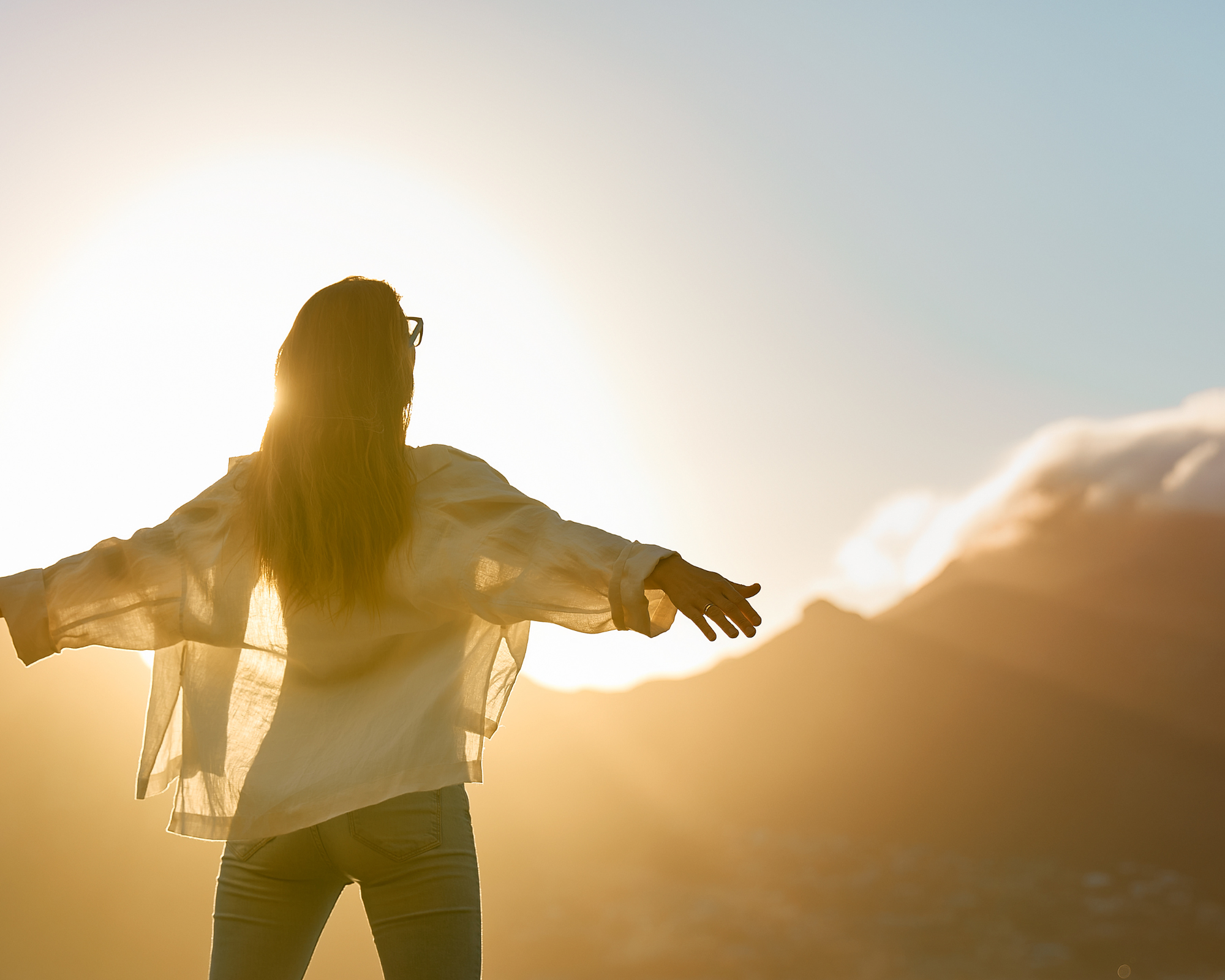 woman standing in the sunlight practicing self worth and joy