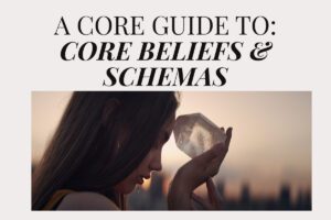 Woman holding a crystal to her forehead at sunset, symbolising reflection on core beliefs and schemas, featured in an article by Tess Rene Coaching.