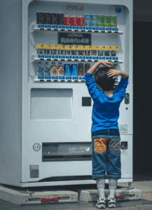 Child overwhelmed by too many options, symbolising hidden reasons for being indecisive, in article by Tess René Coaching.