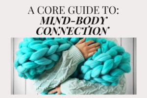 Person in a knitted sweater holding a chunky teal blanket, illustrating comfort and mind body connection, featured in an article by Tess Rene Coaching.
