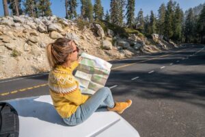 woman checking a map for direction in an article by Tess René Coaching