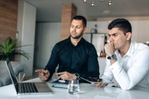 People looking thoughtful, representing clarity in this Tess René Coaching article on solution-focused thinking.