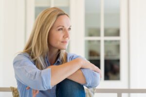 handling disappointment in this Tess René Coaching article showing a woman reflecting represents the emotions of disappointment