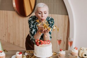 Image in a Tess René Coaching article showing a woman celebrating, representing resilience and the return of joy after hardship.