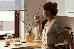 Woman enjoying a quiet morning drink in this Tess René Coaching article on creating space for joy.