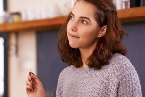 Thoughtful image in a Tess René Coaching article about reframing the meaning of not being accepted.