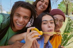 Friends smiling closely together in a Tess Rene Coaching article about relationships as teachers for emotional growth