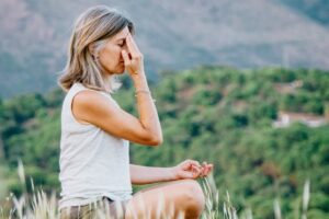 woman practising steady breathing when control fails under stress in this Tess René Coaching article