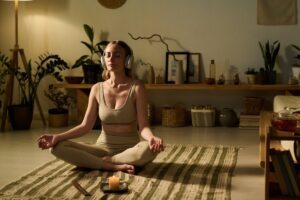 woman meditating at home showing a simple practice to meet emotion in this Tess René Coaching article