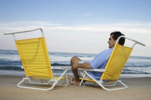 what friendship loss teaches, a person sitting alone by the ocean looking at empty chair beside him, in this Tess Renè Coaching article