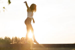 Woman balancing outdoors in this Tess Renè Coaching article about reclaiming emotional sensitivity and self trust